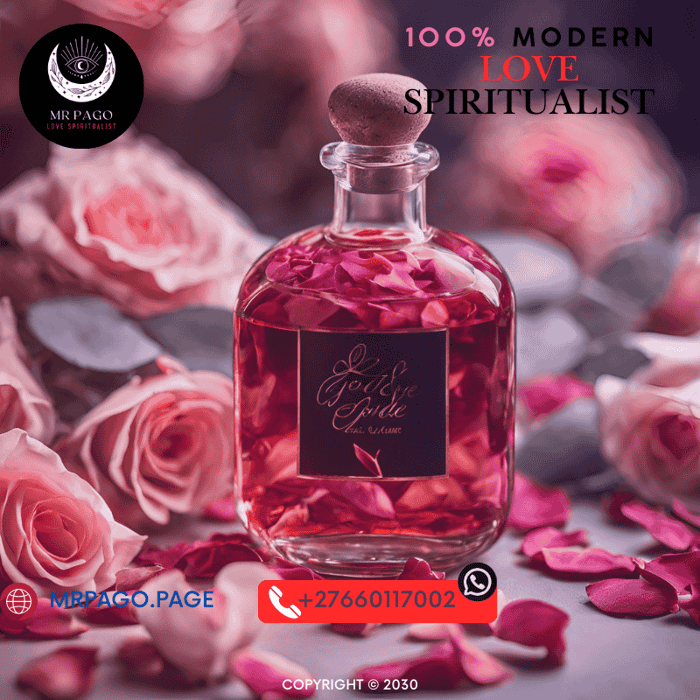 A glass bottle of love Muti surrounded by rose petals and white sage.