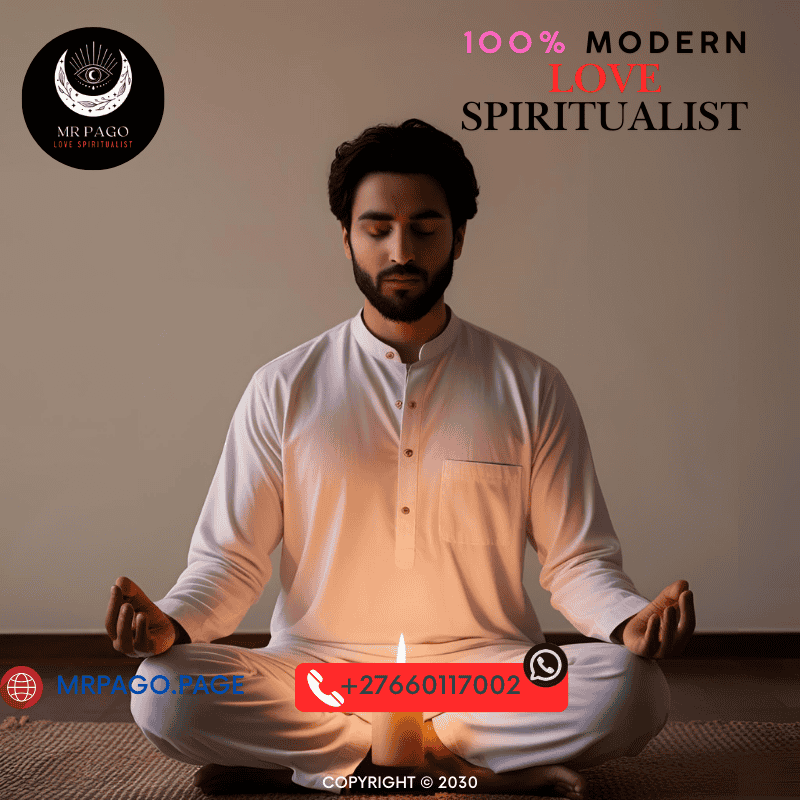 A person meditating with candlelight, focusing on heart healing prayers.