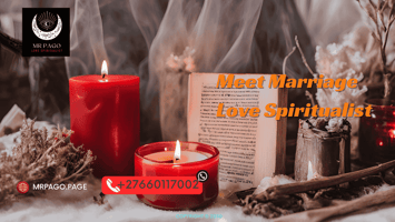 A red candle burning next to a love spell ritual setup.